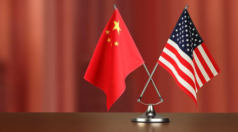 Chinese American Crossed Flag On Desk Negotiation Studiocasper Istock Getty2