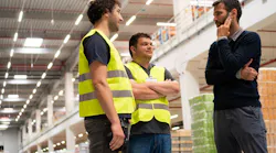 manager speaking with employees