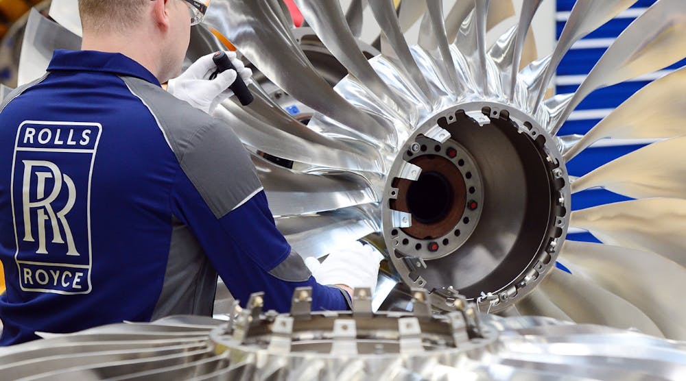 Rolls Royce Worker Examines Engine Blades
