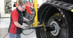 Agco Manufacturing Employee Working On Equipment Agco Manufacturing Employee Working On Equipment