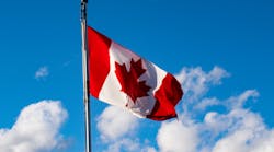Canadian Flag In Front Of Blue Sky With Some White Clouds &copy; Nestor Arturo Velasco Diaz Dreamstime