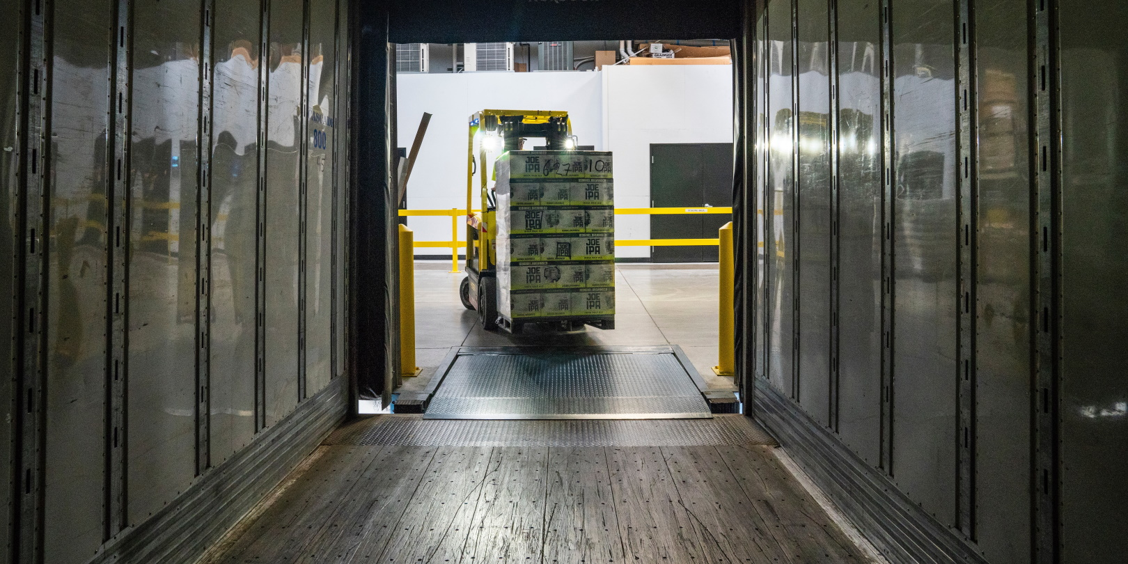 Forklift In Truck Yellow With Load Dark Supply Chain Photo By Elevate On Unsplash 5f92fefcc4c53