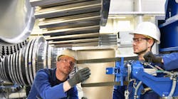 Industrial Hard Hat Workers Assembling Steel Turbine Parts &copy; Industryviews Dreamstime