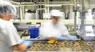 Food Production Line Women Blurry Food Manufacturing Jobs Pralines &copy; Industryviews Dreamstime