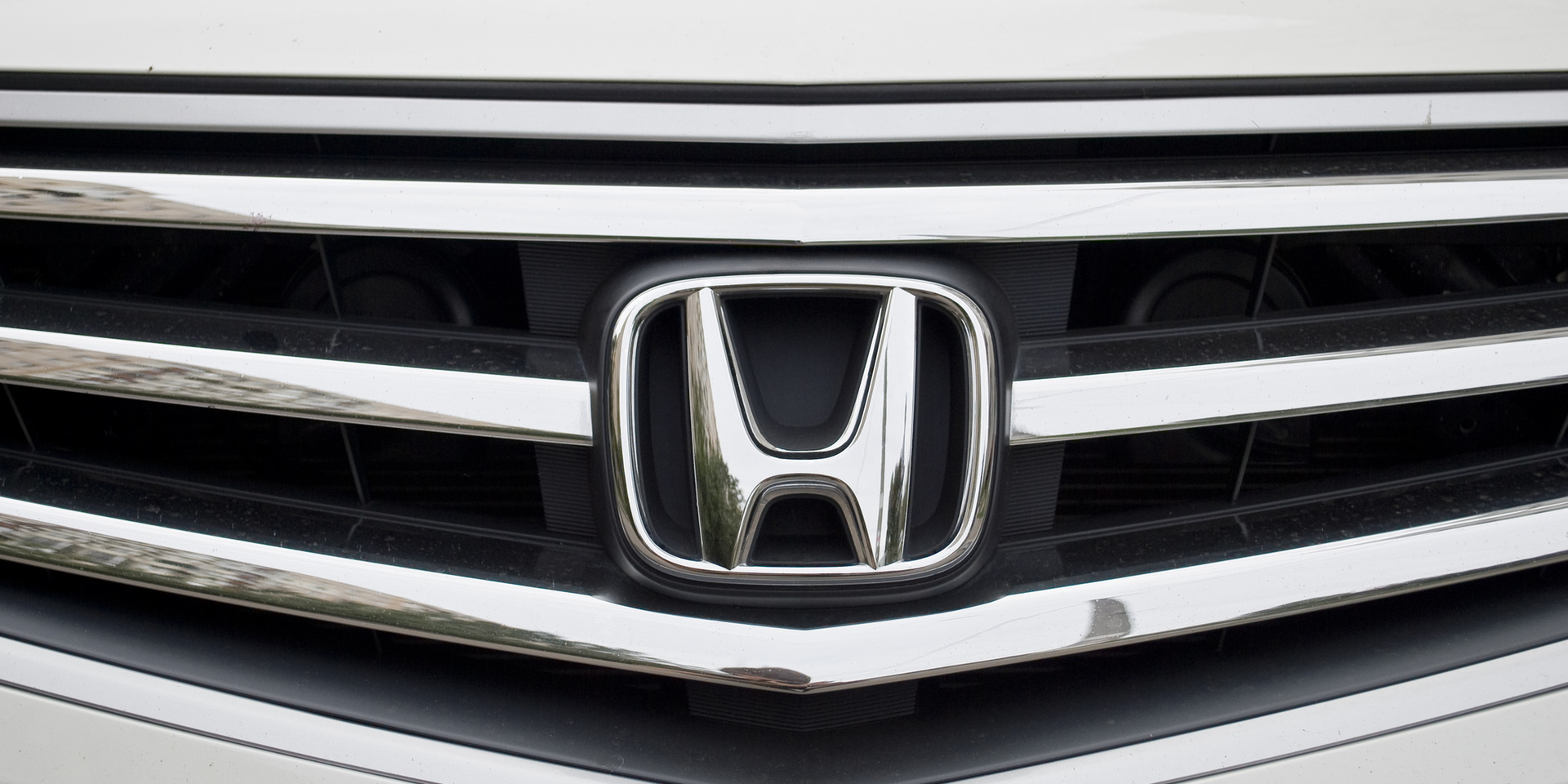Honda Logo On Grill Of Grey Car Vyacheslav Bukhal Dreamstime 5faccdeccb4ad
