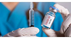 Covid 19 Vaccine Vial Doctor Gloves Syringe &copy; Siam Pukkato Dreamstime