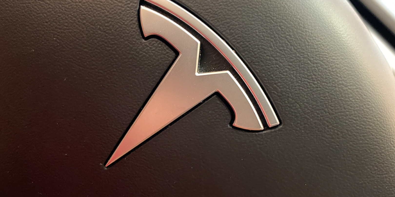 Tesla Logo Steering Wheel Detail Joni Hanebutt Dreamstime 5ff2c19fb10f5