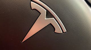 Tesla Logo Steering Wheel Detail &copy; Joni Hanebutt Dreamstime