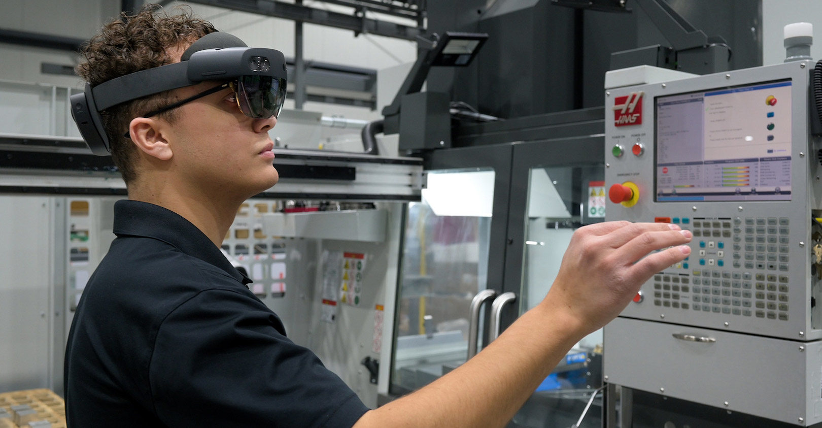 PBC Linear machine operator uses AR equipment to go through work instructions for a job on the Haas machining center. (Credit: PBC Linear)