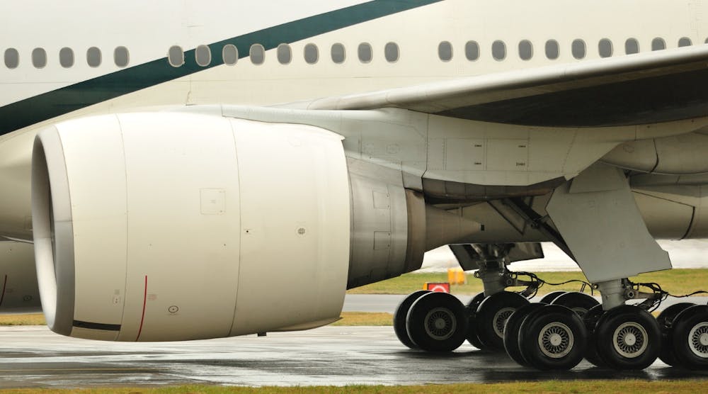 Boeing 777 Engine Undercarriage Landing Gear Tarmac Airport Runway &copy; Tommy Beattie Dreamstime