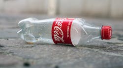 Coca Cola Plastic Bottle Abandoned Pollution Litter Plastics Recycling &copy; Neydtstock Dreamstime