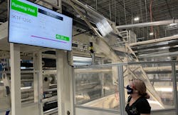 Operator checks a Sight Machine performance monitor at IPG plant in Tremonton, Utah.