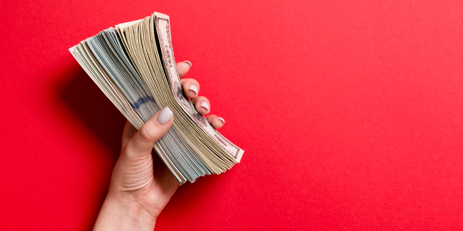 Hand Holding Money Bills Cash On Red Background Mykola Sosiukin Dreamstime 605cb897cf1f1