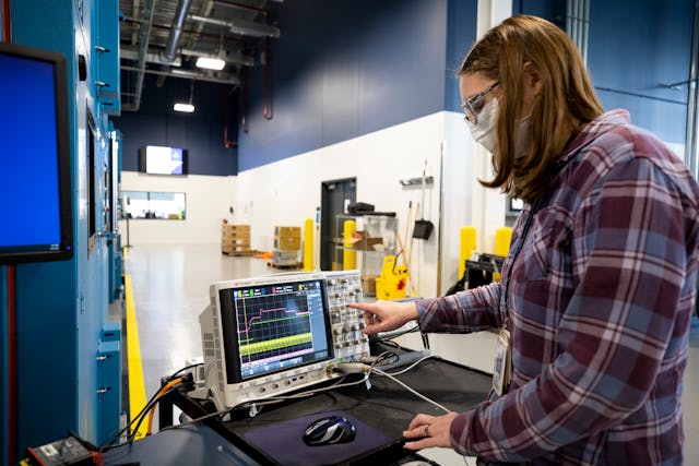Mary Fedrick, Ford Motor Co. battery validation engineer, uses an Oscilloscope, a piece of equipment that captures quick events on a battery pack including the time it takes for the contactors to open or close, at Ford&rsquo;s Battery Benchmarking and Test Laboratory in Allen Park, Michigan. This test confirms the battery is reacting at the correct speed when the vehicle is turned on or off.