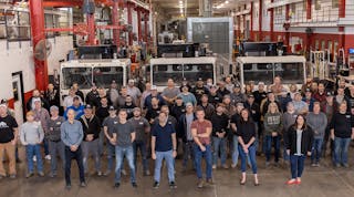 The Crane Carrier workforce gathers in the plant with new leadership.