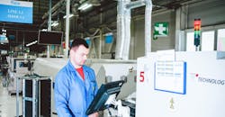 Employee Working On Factory Floor Employee Working On Factory Floor