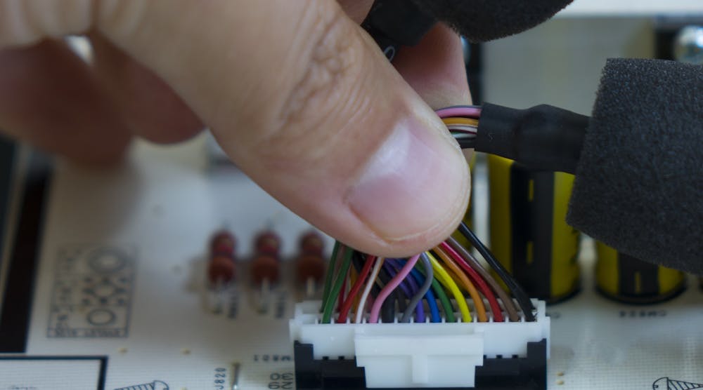 Assembling Electronic Component Hand Production Closeup Microchip Cables &copy; Batuhan Toker Dreamstime