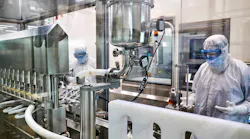 Filling technicians monitor vials being filled inside the aseptic core of a production line at the Greenville, North Carolina, Thermo Fisher Scientific facility. Real time monitoring is necessary to assure product quality and operational efficiency.