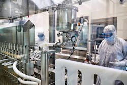 Filling technicians monitor vials being filled inside the aseptic core of a production line at the Greenville, North Carolina, Thermo Fisher Scientific facility. Real time monitoring is necessary to assure product quality and operational efficiency. Filling technicians monitor vials being filled inside the aseptic core of a production line at the Greenville, North Carolina, Thermo Fisher Scientific facility. Real time monitoring is necessary to assure product quality and operational efficiency.