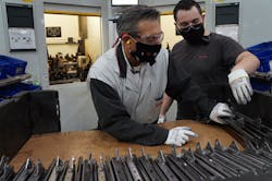 GM Jim Barbaretta gets trained on the line during a monthly “Management Build” event. GM Jim Barbaretta gets trained on the line during a monthly “Management Build” event.