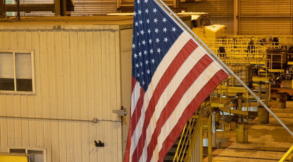 Us American Flag In Factory Setting Yellow Bg Reshoring Id 163250898 &copy; Tloventures Dreamstime