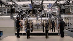 Workers at Lucid's Casa Grande, Ariz., plant connect a Lucid Air vehicle body to its battery pack. Workers at Lucid's Casa Grande, Ariz., plant connect a Lucid Air vehicle body to its battery pack.