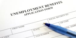 A closeup of unemployment benefits paperwork. A closeup of unemployment benefits paperwork.
