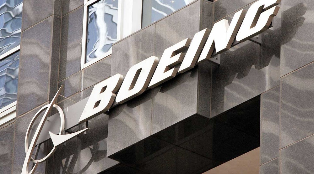 The Boeing company logo on the outside a building.
