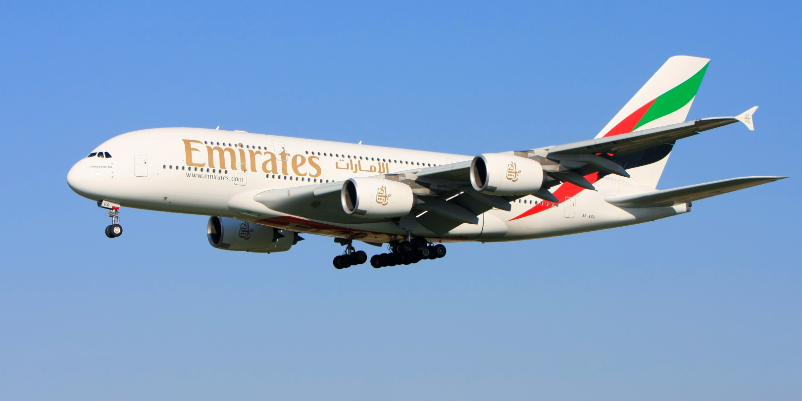 An Airbus A380 in Emirates Airlines livery, approaching the runway for a landing.