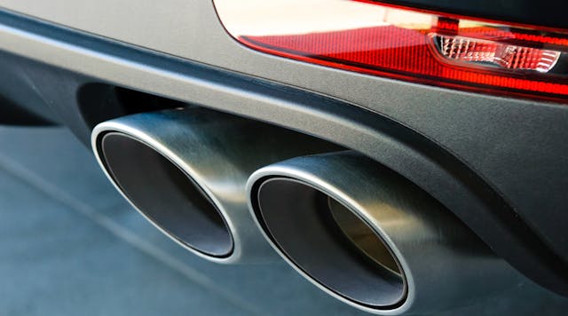 A closeup of a car&apos;s dual exhaust pipes.