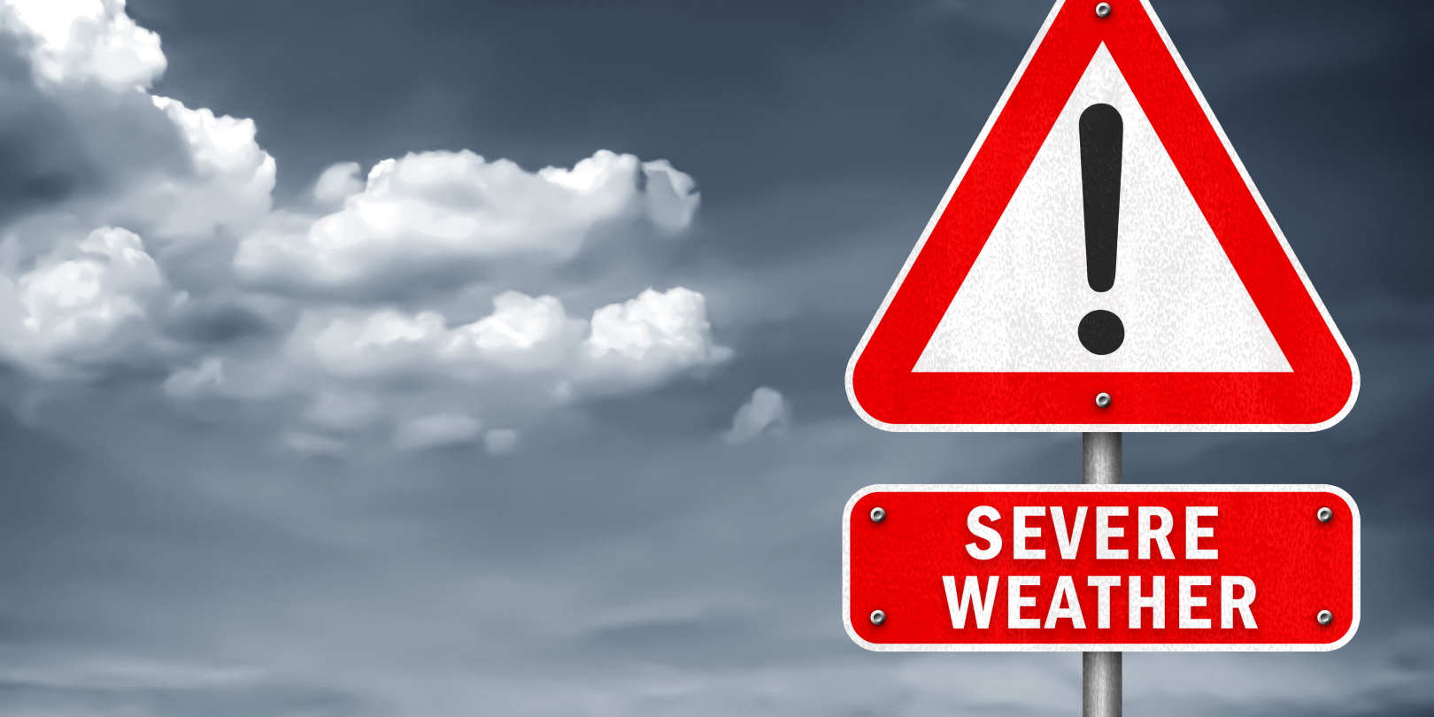 Photo illustration depicting extreme weather with warning sign.