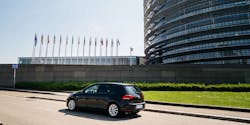 A Volkswagen Golf drives outside the European Parliament building. A Volkswagen Golf drives outside the European Parliament building.