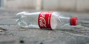 Coca Cola Plastic Bottle Abandoned Pollution Litter Plastics Recycling © Neydtstock Dreamstime