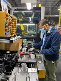 An employee working on the flexible automation cell line at Stanley Black and Decker&apos;s Fort Mill plant.