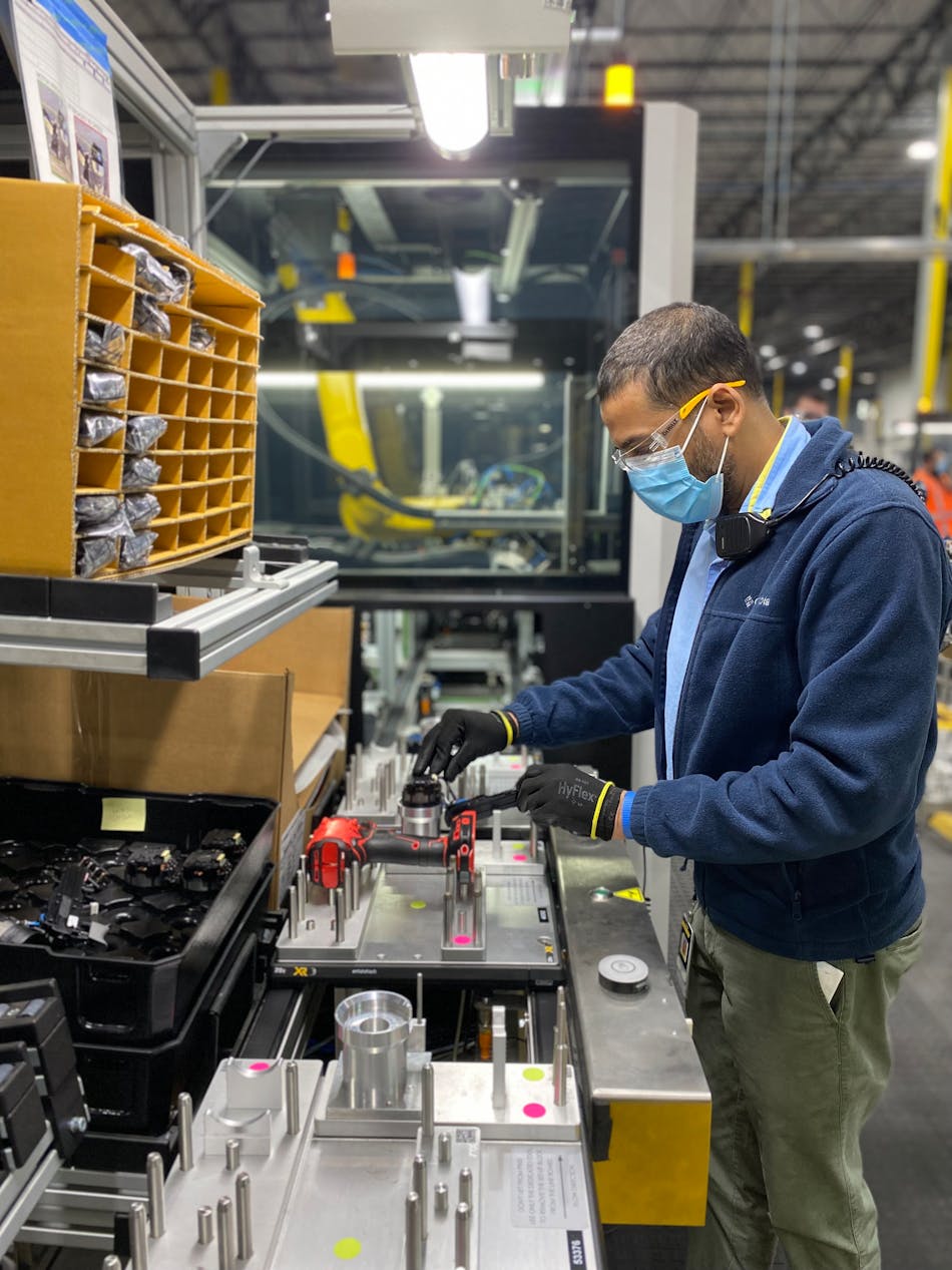 An employee working on the flexible automation cell line at Stanley Black and Decker&apos;s Fort Mill plant.