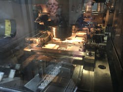 This is an interior view of a Grabener coining press at SilverTowne Mint. If you look closely, you can see small components created by Falcon Industries being used to grip the silver rounds. This is an interior view of a Grabener coining press at SilverTowne Mint. If you look closely, you can see small components created by Falcon Industries being used to grip the silver rounds.