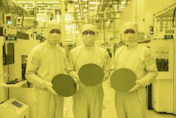 Samsung researchers in Korea display new microchip wafers made using cutting-edge technology. Samsung researchers in Korea display new microchip wafers made using cutting-edge technology.