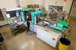 Briana Miranda operates an injection molding machine on the factory floor. Briana Miranda operates an injection molding machine on the factory floor.