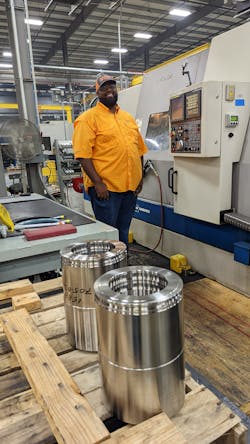 Gurmeet Setia runs a lathe, one of a handful of standalone machines that aren't part of larger cell. The orange shirt identifies him as a member of the safety committee. Gurmeet Setia runs a lathe, one of a handful of standalone machines that aren't part of larger cell. The orange shirt identifies him as a member of the safety committee.