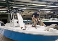 A worker builds boats at TN Composites plant in White Bluff, Tennessee.