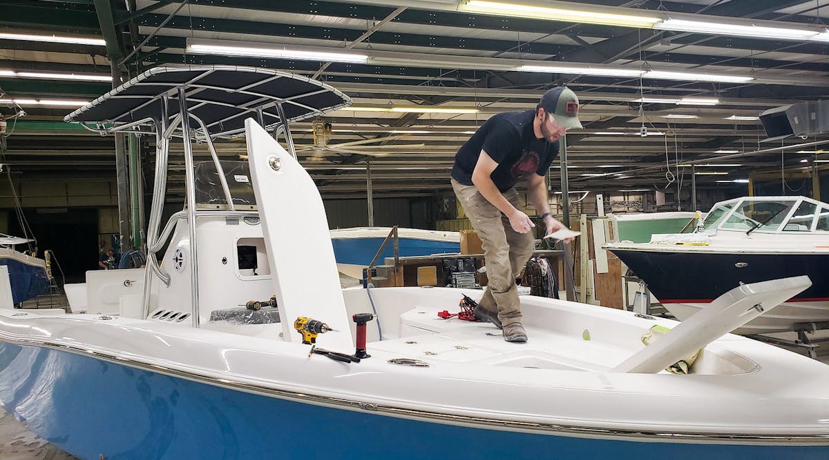 A worker builds boats at TN Composites plant in White Bluff, Tennessee.
