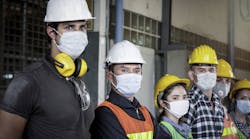 Helmeted Manufacturing Warehouse Safety Employees