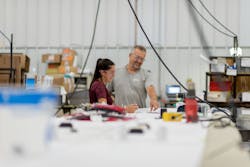 Workers collaborate at MCL Industries in Wisconsin. Workers collaborate at MCL Industries in Wisconsin.