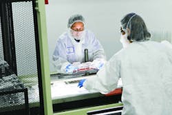 Workers in a clean room at a Jamestown Plastics plant. Workers in a clean room at a Jamestown Plastics plant.