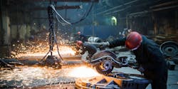 Worker Grinding Cutting Metal Sparks Big Saw Roman Kosolapov Dreamstime