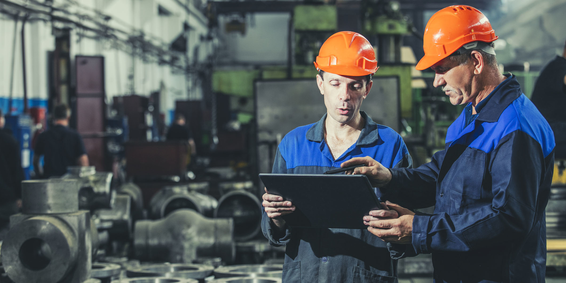 Two Helmeted Workers Tablet Evgeniia Kuzmich Dreamstime 63fd36c1c455c