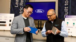 Charles Poon, Ford&apos;s director of Electrified Systems Engineering, holds a lithium iron phosphate (LFP) battery, while Anand Sankaran, director of Ford Ion Park holds a nickel cobalt manganese (NCM) battery. Ford currently uses NCM in its electric vehicles, and will add LFP to its lineup beginning later this year to help it produce more EVs and make them more accessible and affordable for customers.