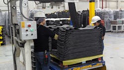 Following mixing, milling, cleaning and cooling, rubber strips come off the line where workers fold them into stacks for shipment to other plants in Mexico as well as plants in the U.S. and Canada.