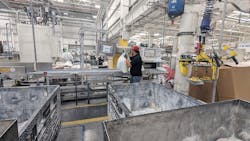 Workers put carefully portioned quantities of polymers and other chemicals on conveyor belts that carry the materials into giant mixing machines. As professional bakers would tell you, following recipes by weight instead of volume metrics ensures consistent batch properties. Workers put carefully portioned quantities of polymers and other chemicals on conveyor belts that carry the materials into giant mixing machines. As professional bakers would tell you, following recipes by weight instead of volume metrics ensures consistent batch properties.