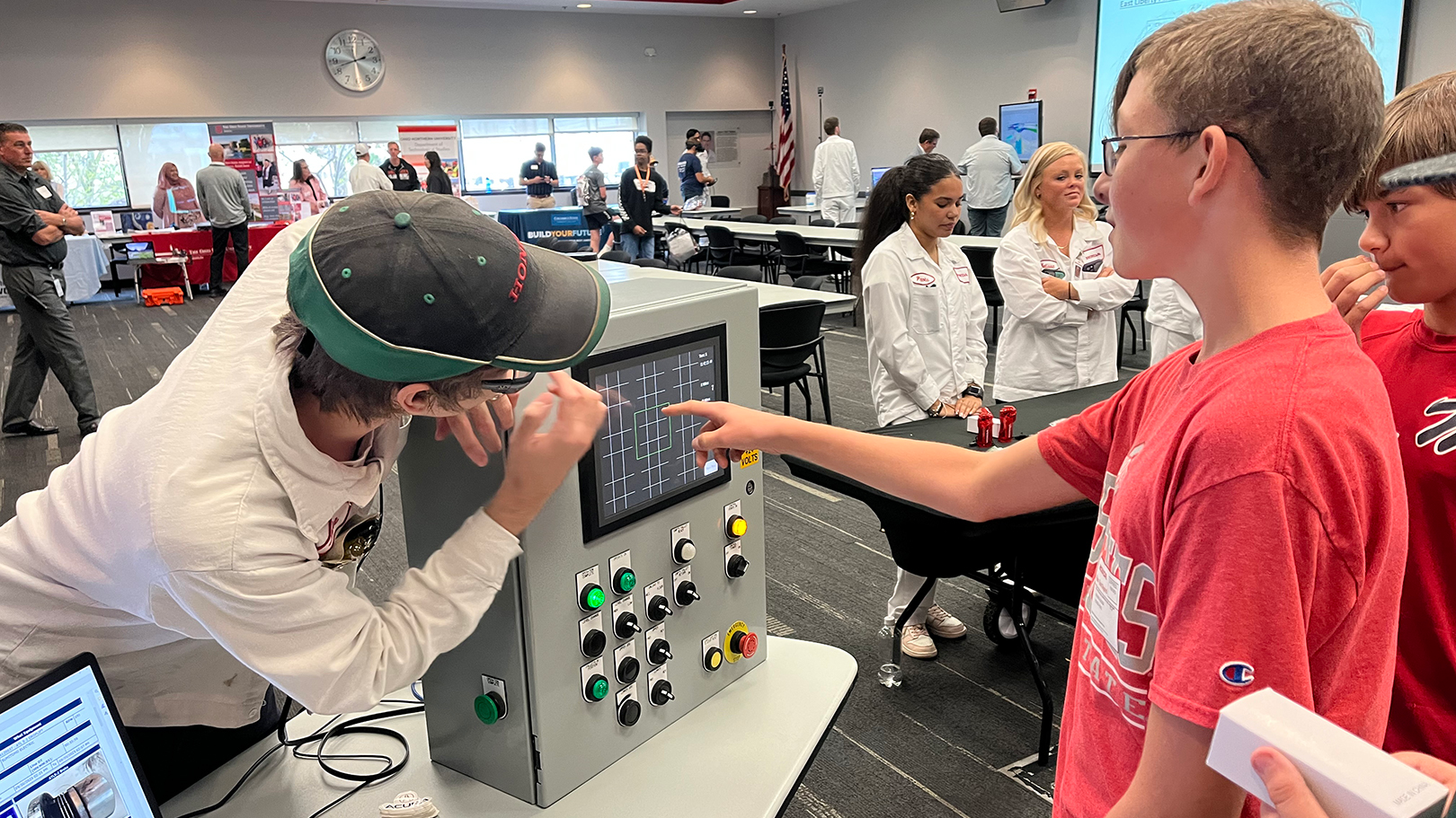 River Valley Middle School students learn about manufacturing control panels.